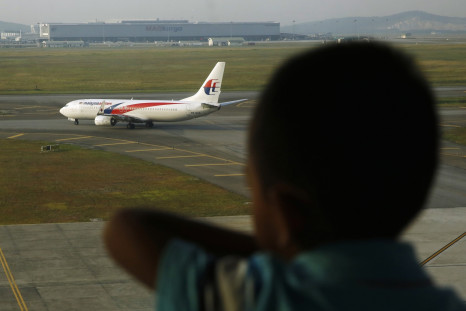 MH370 book author Ewan Wilson has defended his 'Truth' book from criticism by Malaysia Airlines