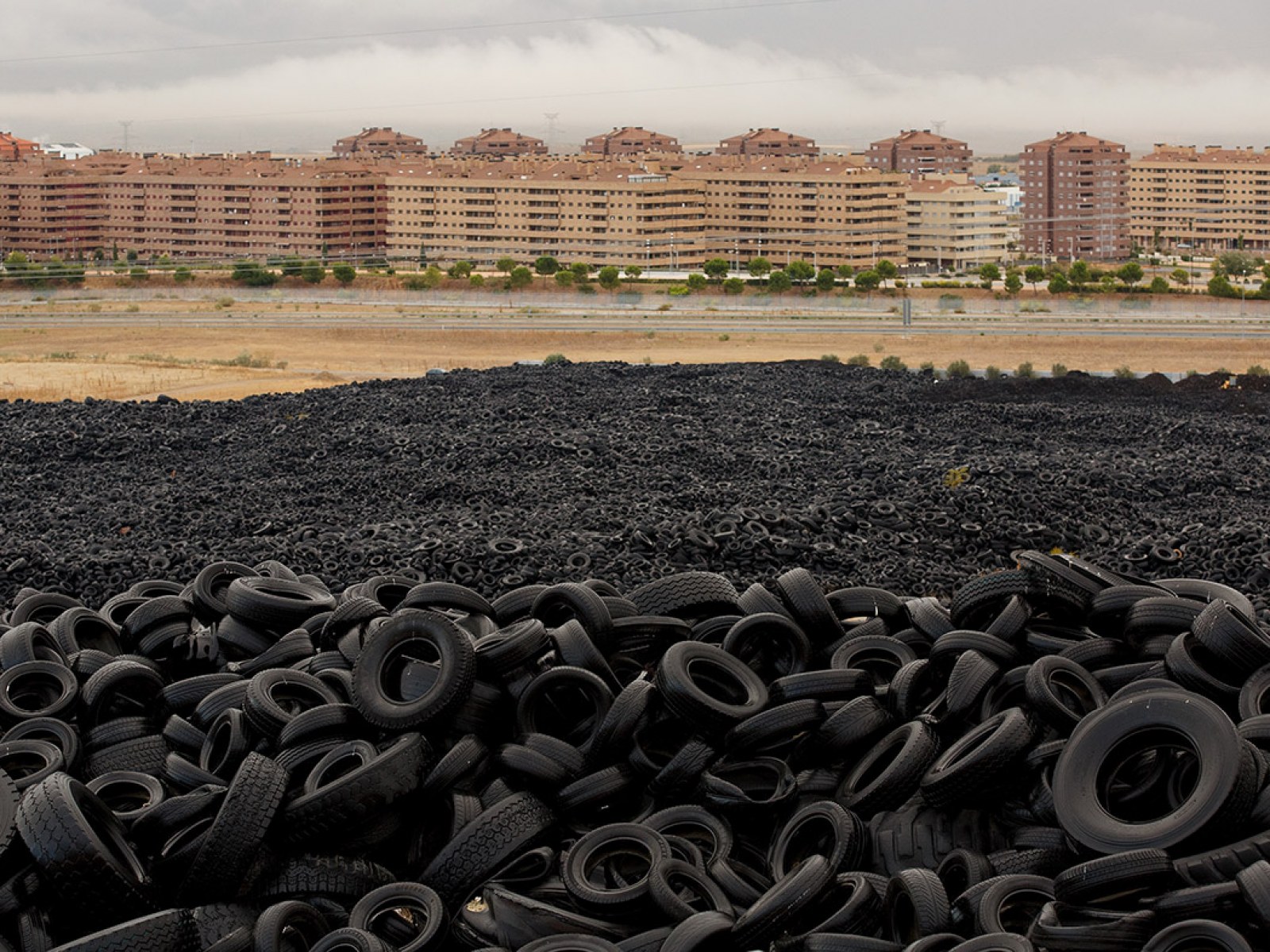 Millions of Old Tyres are Dumped Near Empty Apartment Blocks in Spanish  Ghost Town | IBTimes UK