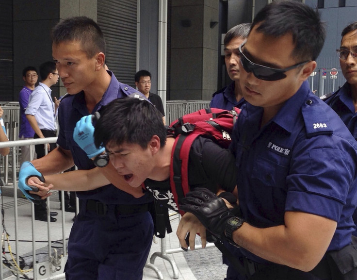 Hong Kong riot police used pepper spray to disperse protesters around government headquarters