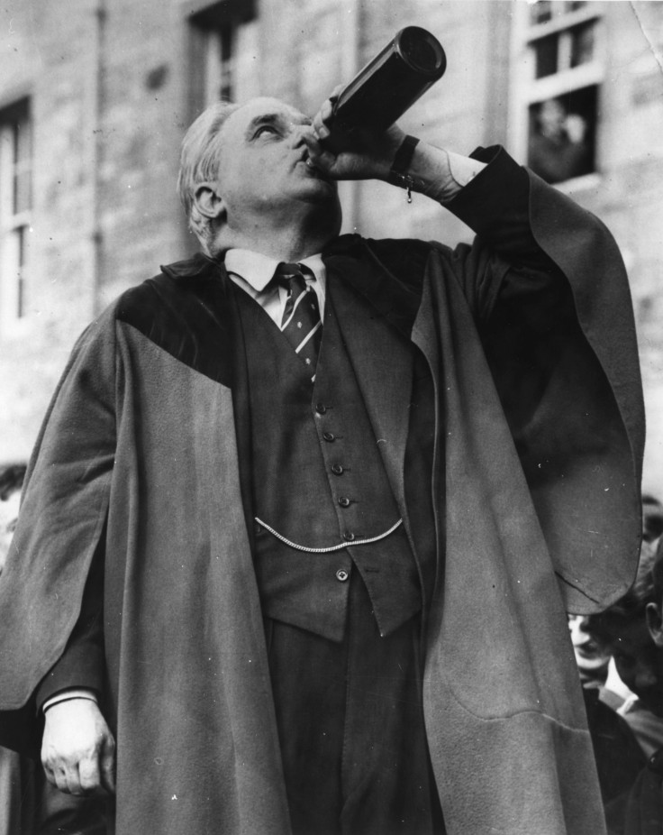 Robert Boothby downs a bottle of ale, as part of the traditional ceremony as he is made Rector of Aberdeen University in 1959 (Getty)