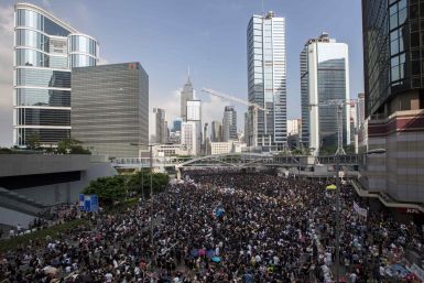 Thousands of Protesters Block Hong Kong Roads after Night of Violence