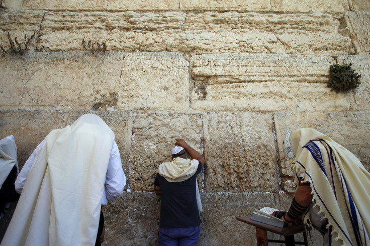Jewish men pray at the Western Wall, Judaism's holiest prayer site, in Jerusalem's Old City September 17, 2014