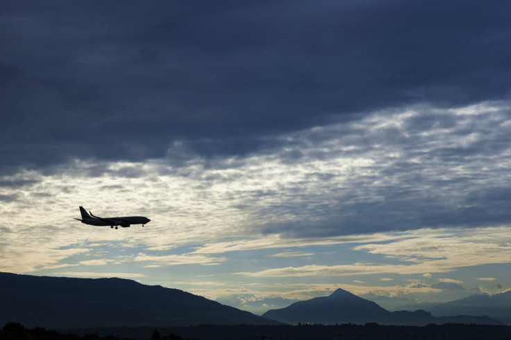 An El Al Airlines aircraft prepares for landing in Cointrin airport during sunrise over the Mont Blanc in Geneva September 9, 2014