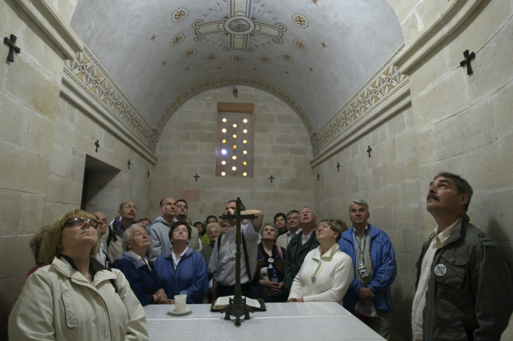 Tourists from Poland pray inside the Church of the Transfiguration on Mount Tabor near the northern Israeli city of Nazareth May 5, 2009