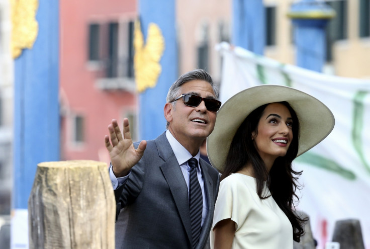 George Clooney and his wife Amal Alamuddin arrive at Venice city hall for a civil ceremony to formalise their wedding in Venice on 29 September, 2014