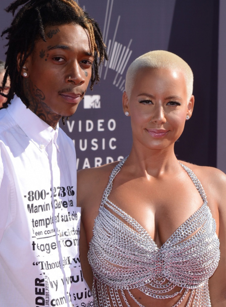 Wiz Khalifa and Amber Rose divorce: Model covers tattoo of rapper's face  with sleeve of roses