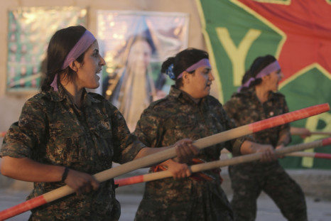 Kurdish female fighters of the Women's Protection Unit (YPJ) participate in training at a military camp in Ras al-Ain city in Hasakah province