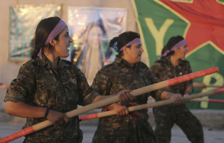 Kurdish female fighters of the Women's Protection Unit (YPJ) participate in training at a military camp in Ras al-Ain city in Hasakah province