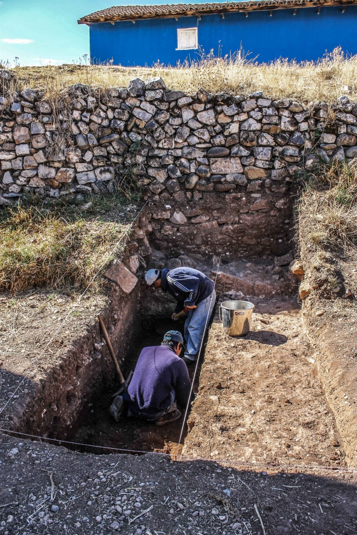 Peru state archaeologists digging near the remains of an ushnu stone ceremonial platform found in the city of Jauja