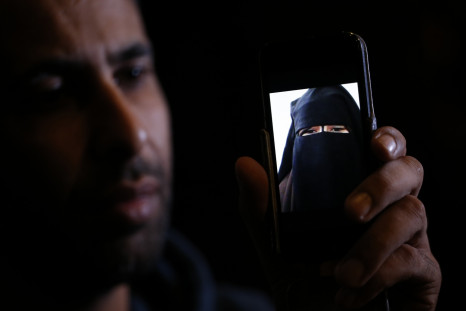 Foad Al-Bahty shows a picture his 15-year-old sister sent him from Syria after joining IS. (Reuters)