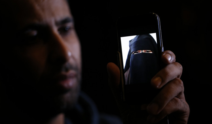 Foad Al-Bahty shows a picture his 15-year-old sister sent him from Syria after joining IS. (Reuters)