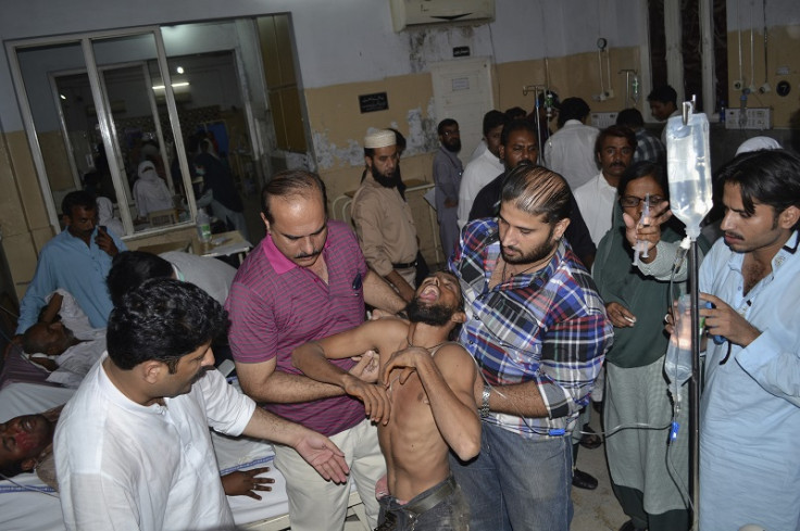 A wounded Imran Khan supporter is taken to hospital after the stampede in the Pakistan's central city of Multan, which killed at least seven and injured 42