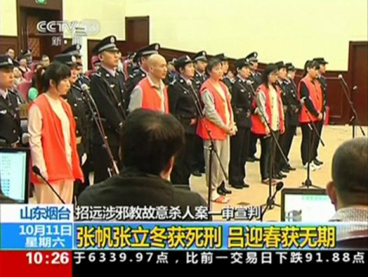 Still of the trial of the cult memebers from Chinese state TV.