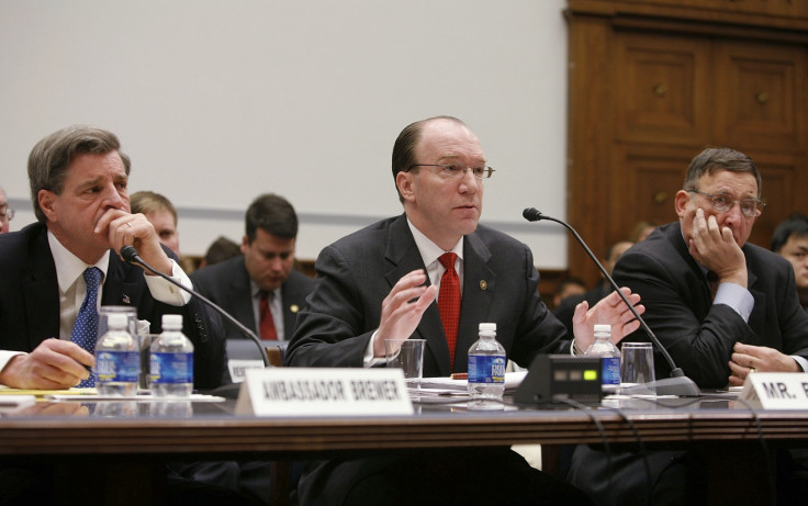 Stuart W Bowen testifies at the US Congress. To his right, is Paul Bremer, former head of the Coalition Provisional Authority. (Getty)