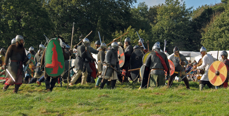 The Norman army fights the Anglo-Saxons at the Battle of Hastings 2014 re-enactment