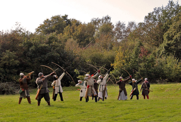 Norman archers fire into the air on the order of their commander