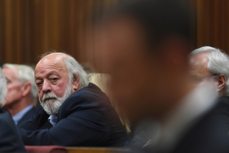 Barry Steenkamp (rear) does not want 'blood money' from Oscar Pistorius (front)