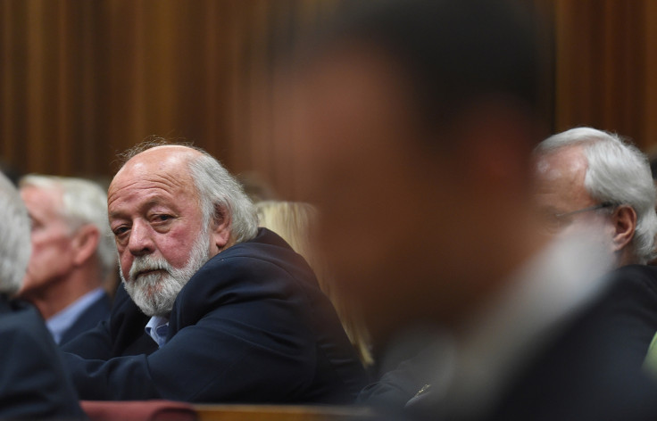 Barry Steenkamp (rear) does not want 'blood money' from Oscar Pistorius (front)