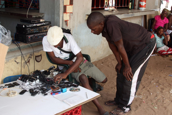 A street vendor sells mobile phones in Mozambique.