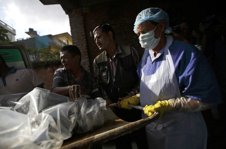 The body of a victim is moved from an ambulance to the morgue after it was brought back from Annapurna Region in Kathmandu (Reuters)