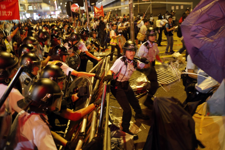 Riot police move into a protest site during clashes with pro-democracy protesters at the Mongkok  district of Hong Kong
