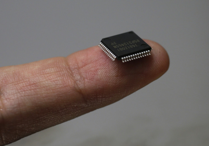 Renesas Electronics Corp's microcontroller chip sits on a finger