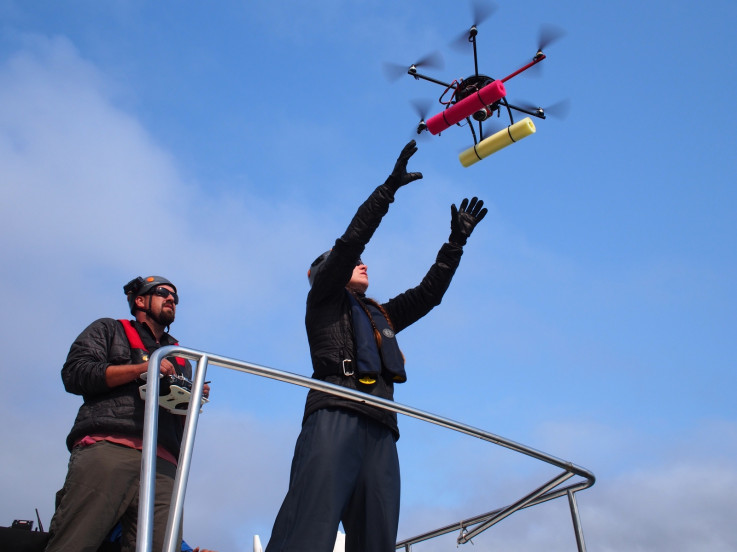 Researchers John Durban and Holly Fearnbach launch the Mobly drone from the roof of the Skana boat