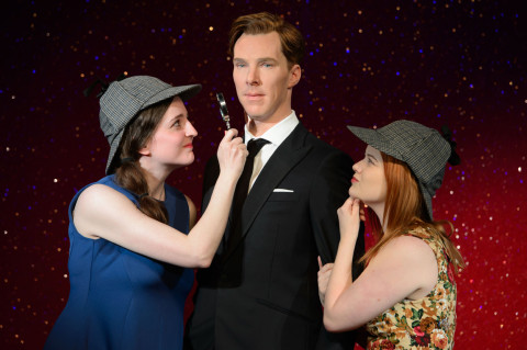 Two lucky fans who won a competition to attend a private viewing of the Benedict Cumberbatch wax figure don Sherlock Holmes' signature deerstalker hat