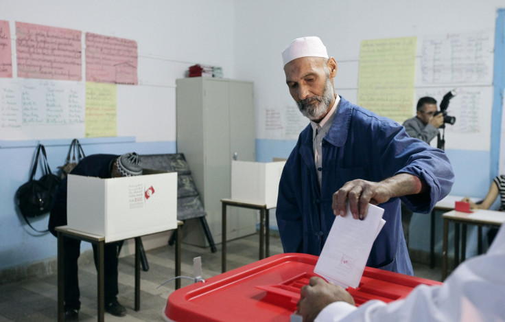 A man casts his vote at a polling station in Tunis October 26, 2014. Tunisians elect a new parliament on Sunday as the prospect of a full democracy finally comes within their reach, four years after they cast out autocrat Zine El-Abidine Ben Al