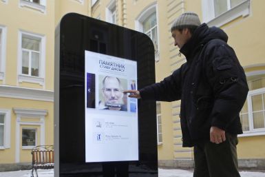 A man looks at a recently erected iPhone-shaped monument in memory of Apple's late co-founder Steve Jobs in the yard of the State University of Information Technologies, Mechanics and Optics in St. Petersburg January 10, 2013