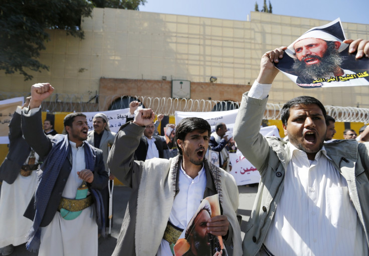 Shi'ite protesters carry posters of Sheikh Nimr al-Nimr during a demonstration outside the Saudi embassy in Sanaa