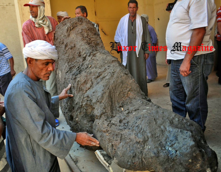 The statue of a seated figure made from pink granite has been recovered from an ancient submerged temple in El Badrashin