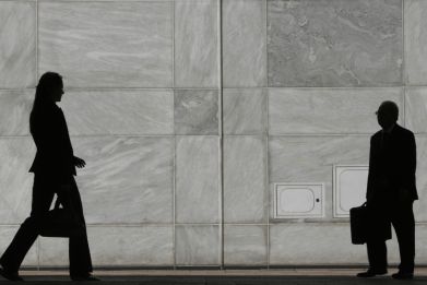 Woman walks in Canary Wharf