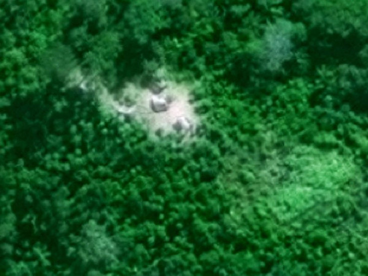 An isolated indigenous maloca (longhouse) in the middle of the rainforest found using satellite imagery