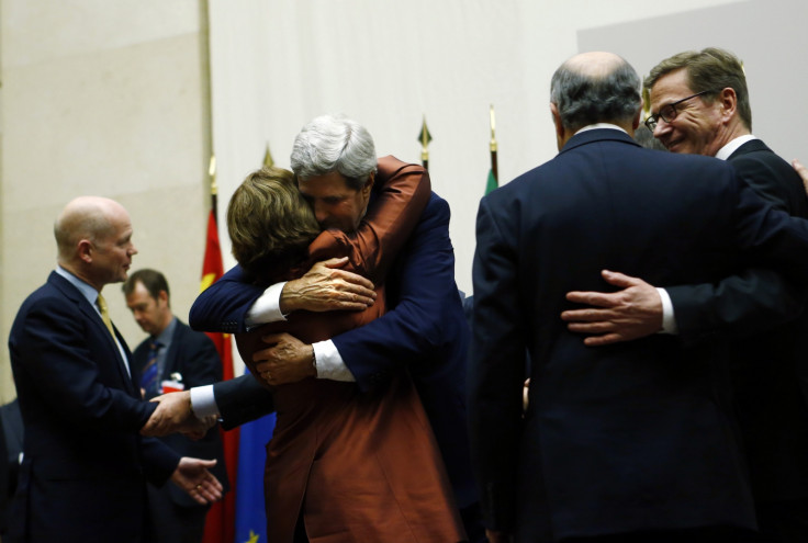 U.S. Secretary of State John Kerry (3rd R) hugs European Union foreign policy chief Catherine Ashton after she delivered a statement during a ceremony next to British Foreign Secretary William Hague (L), Germany's Foreign Minister Guido Westerwelle (R) a