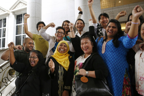 Activists celebrate overturning a sharia law against cross-dressing at the Appeals Court in the Palace of Justice in Putrajaya November 7, 2014