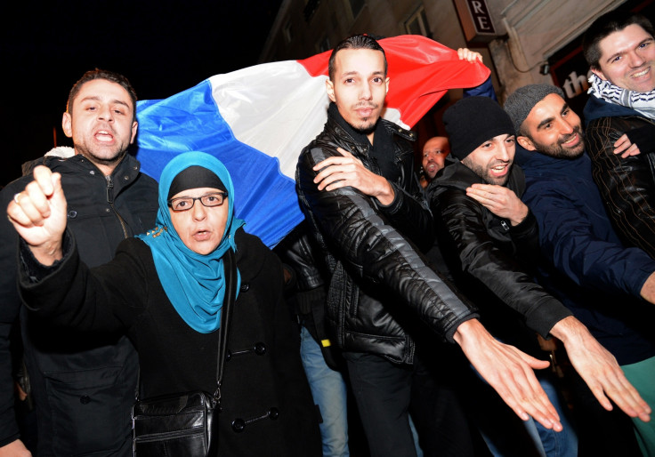 French protesters perform the 'Quenelle' salute, branded anti-Semitic by Jewish groups. (PIERRE ANDRIEU/AFP/Getty Images)
