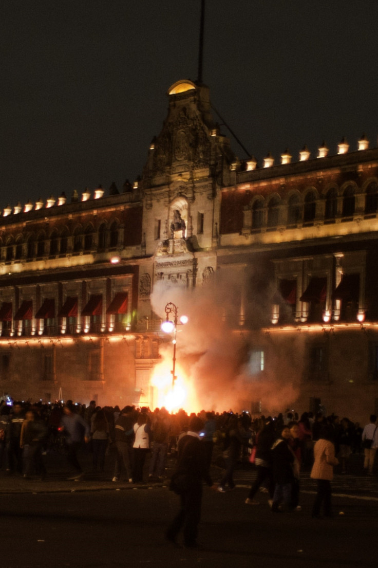 Protesters attempt to storm Mexico's National Palace last night (Getty)