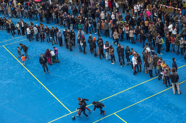Catalans queue to vote in Barcelona today.