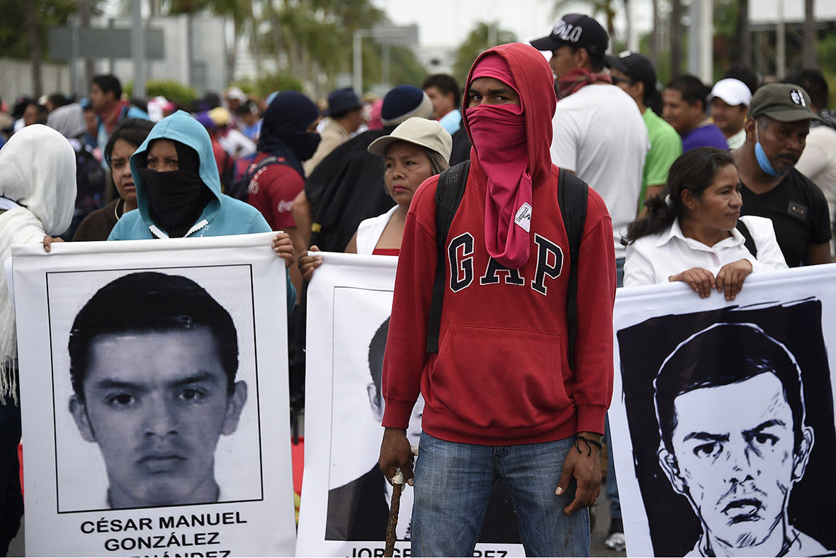 Mexico's 43 missing students 10 decapitated corpses and 11 heads