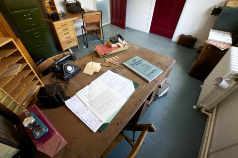 A recreation of Alan Turing's office, including his mug, chained to the radiator behind his desk