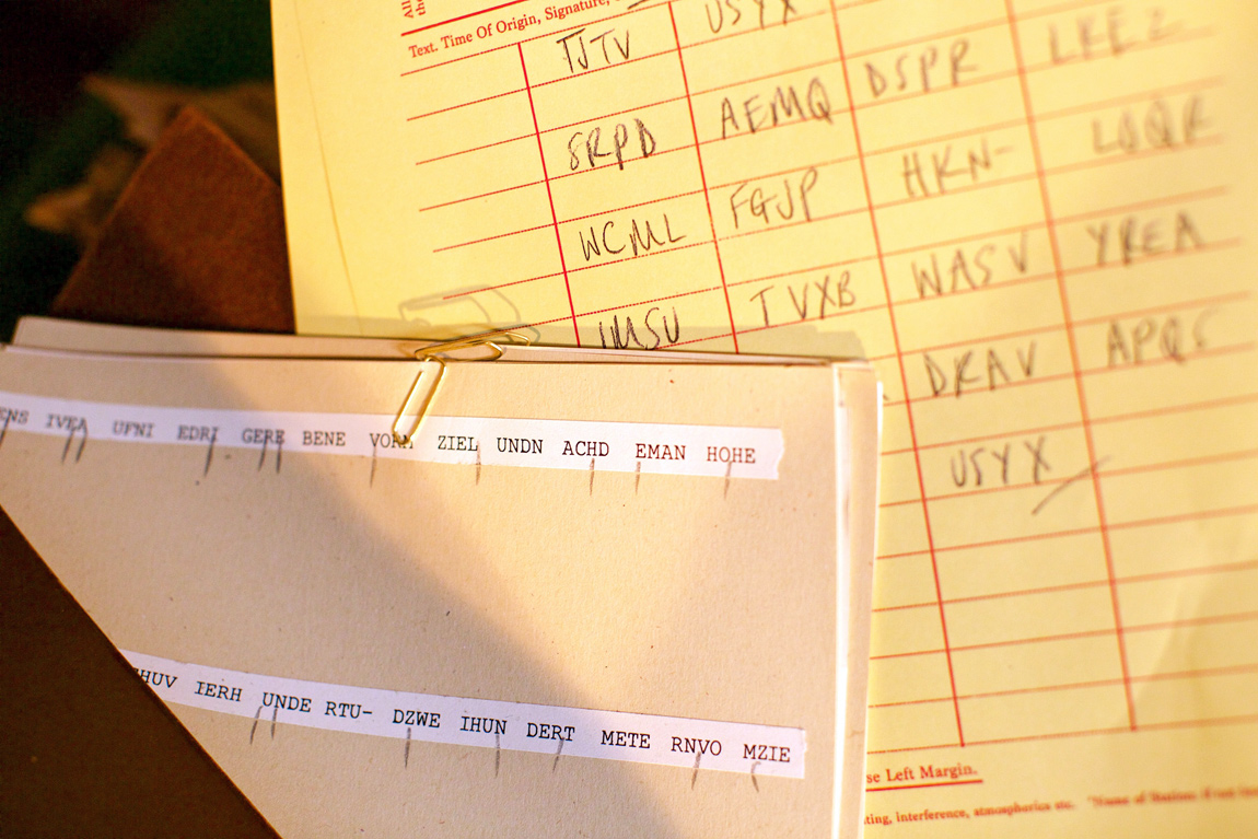 Message tapes of encrypted code with notes on possible variations of what each letter could be Message tapes of encrypted code with notes on possible variations of what each letter could be