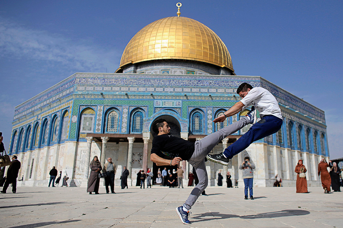 Palestinian youths practise their parkour skills during Friday prayers at the Dome of the Rock in Jerusalems Old City