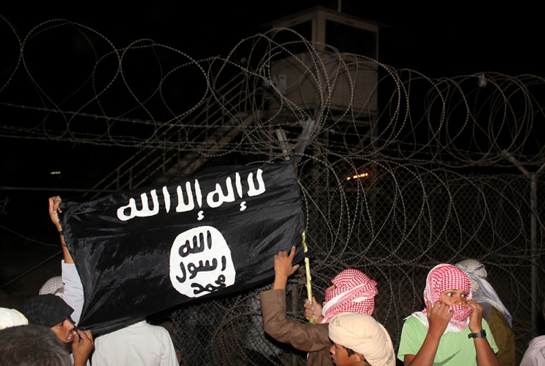 Protesters in Sinai hold aloft the Isis flag. (Getty)