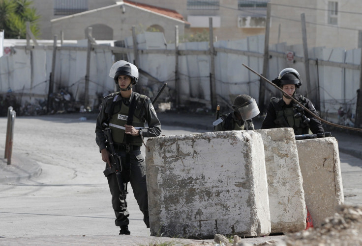 Israeli forces guard the homes of the two suspected synagogue attackers in Jabal al-Mukabbir, east Jerusalem (Getty)