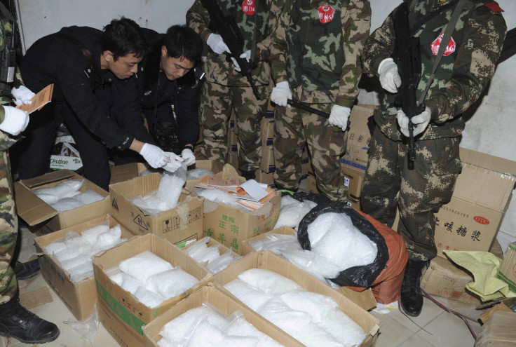 Police check seized crystal meth at Boshe village, Lufeng, Guangdong province