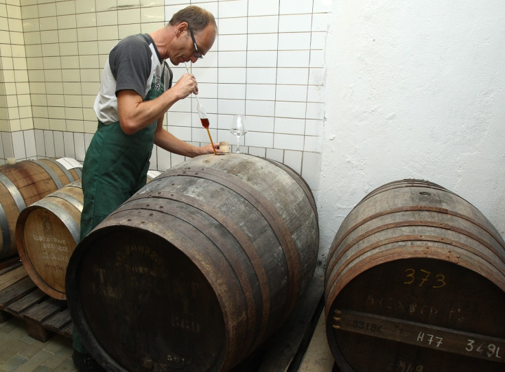 Austrian brewer Peter Krammer tries a sample of aging beer in his family-owned Hofstetten brewery.