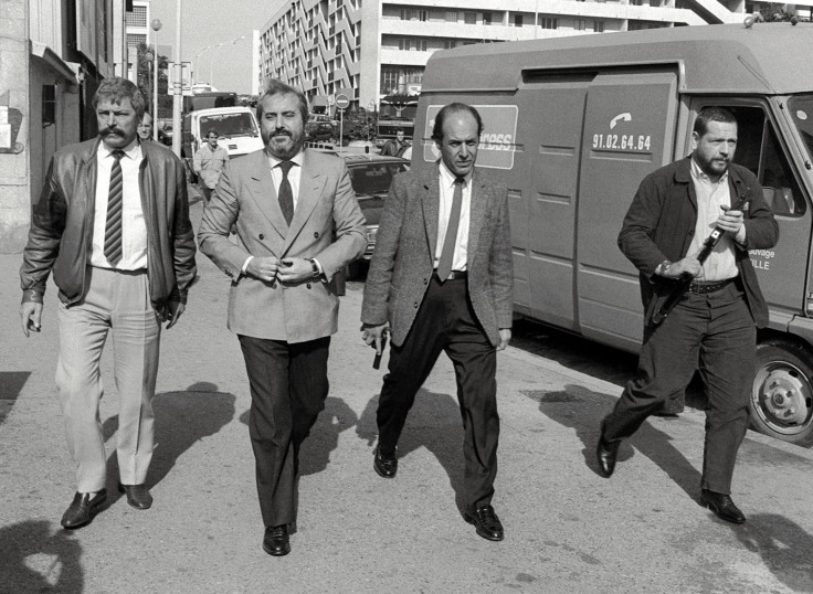 Giovanni pictured in 1986 flanked by bodyguards. Six years later he was dead, assassinated by the Sicilian  mafia. (Getty)