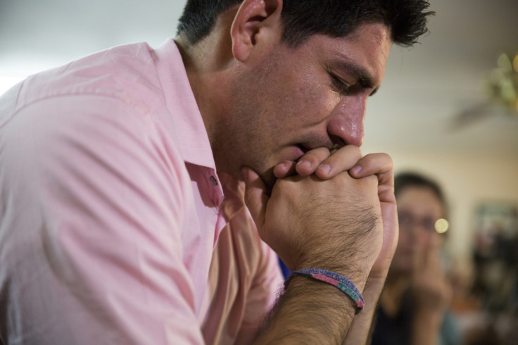 Jose Patino, a DREAMer, becomes emotional while watching U.S. President Barack Obama's national address in Phoenix
