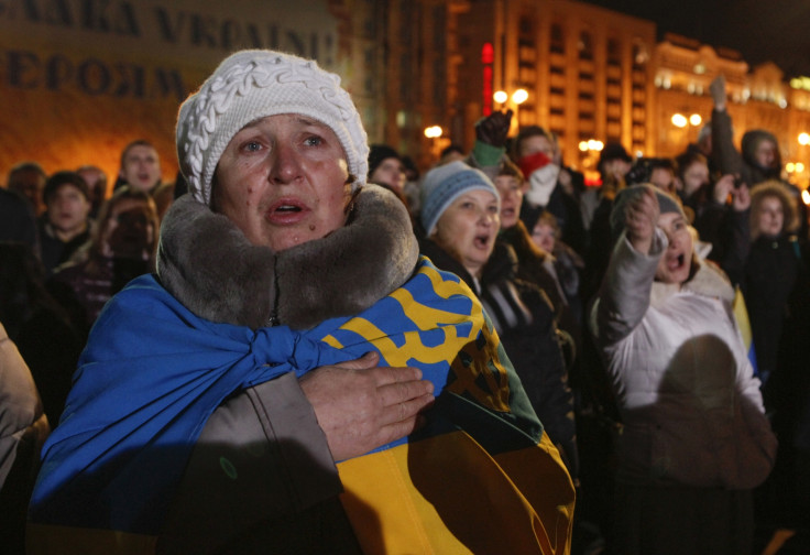 People sing the national anthem as they take part in a rally at the Independence Square in Kiev November 21, 2014